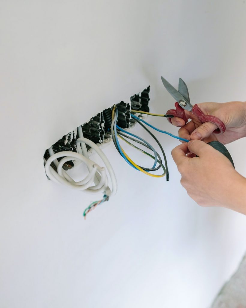 Electrician working on the electrical installation of a house