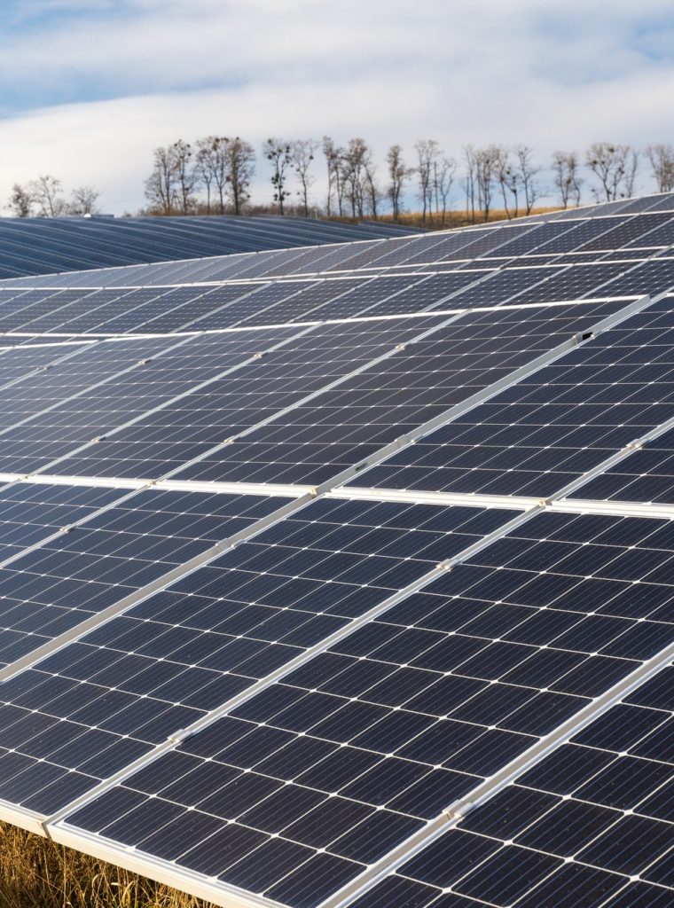 Solar photovoltaic panels on the modern complex among beautiful nature landscape. Ecology concept